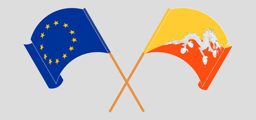 Crossed and waving flags of the European Union and Bhutan
