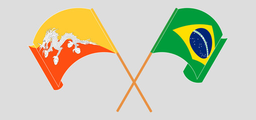 Crossed and waving flags of Bhutan and Brazil