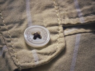 Button in the back pocket of pants.