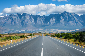 Fototapeta premium Open Highway to Scenic Mountain Range