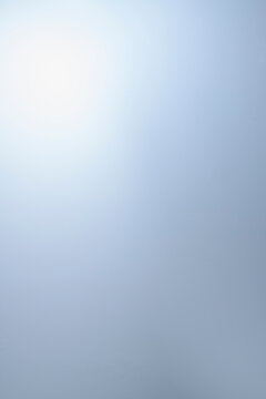 Gently blue background with a light gradient area. Vertical