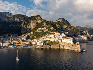 Amalfi, Italy: Dramatic aerial of the famous Amalfi village with its beach and old church and...