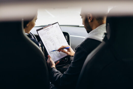 Woman passing driving test at driving school