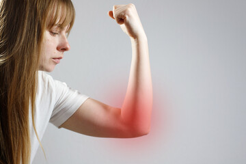 close-up woman feels pain in her elbow