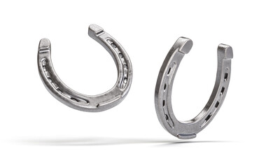 Pair of silver horseshoes on white background