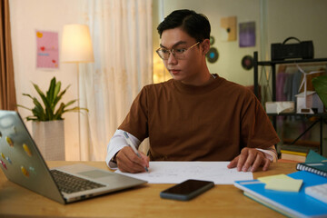 High school student studying at home
