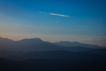 Fototapeta premium Layered silhouette of hills at sunset from Mount Nemrut