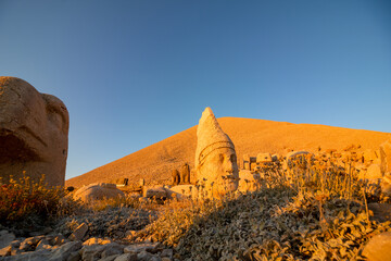 Mount Nemrut sculptures at sunset. Visit Turkey concept