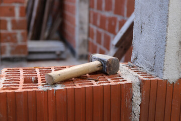 
Hammer on construction site. House construction. Concept of architecture, construction,...
