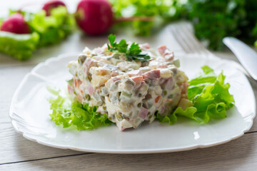 vegetable salad with boiled vegetables and dressed with mayonnaise
