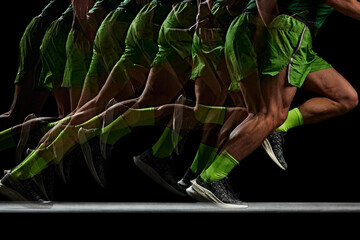 Energy and strength. Cropped image of athletic, muscular male legs in motion, running against black background with stroboscope effect. Concept of sport, active and healthy lifestyle, endurance