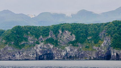 A unique landscape of coastal sheer cliffs and eroded caves on the west edge of a volcanic plateau...