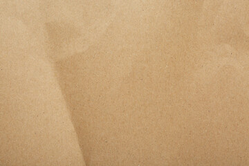 Kraft paper notebook sheet as background, top view