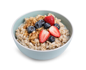 Tasty oatmeal with strawberries, blueberries and walnuts in bowl isolated on white