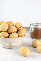 Russian cookies Nuts or Oreshki in shape of a walnut with boiled condensed milk. Russian cuisine, desserts. Copy space.