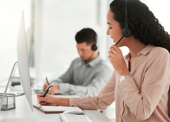 Call center, computer and woman writing notes in office for telemarketing online consultation....