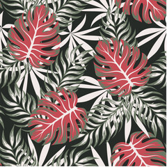 Botanical seamless tropical pattern with bright plants and leaves on a dark green background. Seamless pattern with colorful leaves and plants. Trendy summer Hawaii print.
