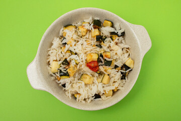 Boiled rice with vegetables in small bowl