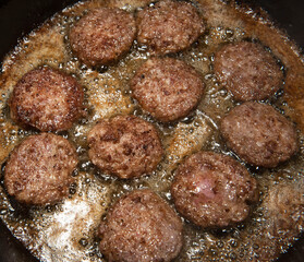 Breakfast Sausage frying in a pan