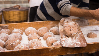 Yeast dough in the form of loaves waiting to be cooked
