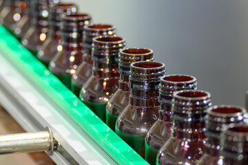Close up scene the empty drug  bottles  on the conveyor belt for filling process.