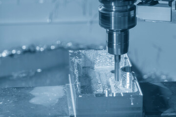 The CNC milling machine cutting  mold part by solid flat end mill tool.