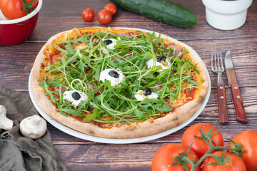 pizza with tomatoes and basil