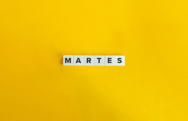 Word MARTES. Tuesday in Spanish. Text on Block Letter Tiles on Flat Background. Minimalist...