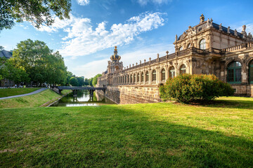 Fototapeta na wymiar Dresden Zwinger palace in summer day, green grass on foreground