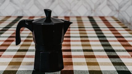 Black coffee pot on the table