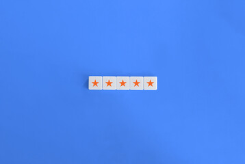 5 Orange Stars Banner. Excellency, Rating, Review, First Class, First Rate, Superior, Top-notch Concept. Letter Tiles on Blue Background. Minimalist Aesthetics.