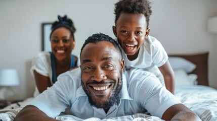 Happy family and bedroom portrait with father, mother, and child smiling. Mother and father in bed...