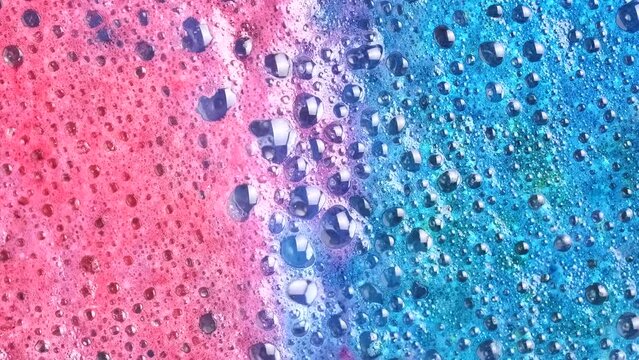 Colorful Soapsuds. Pink And Blue Foam Bubbles When Dissolving A Salt Cosmetics Bomb, Macro. Cosmetics Background