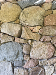 wall and stones of Sardinian granite from Gallura