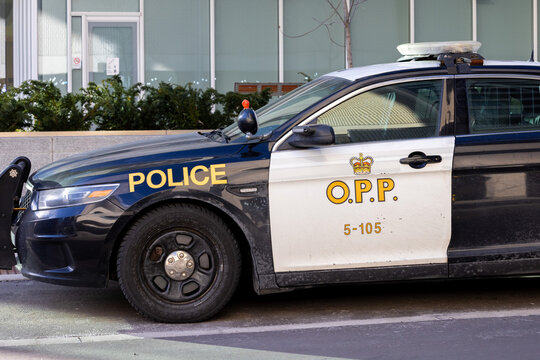 Toronto, Canada, January 4, 2024; The front of an Closeup of an Onrtaio Provincial Police, OPP, cruiser in downtown Toronto showing the gold OPP and crown door logo.