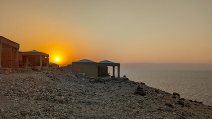 Chalets on the dead sea at sunset