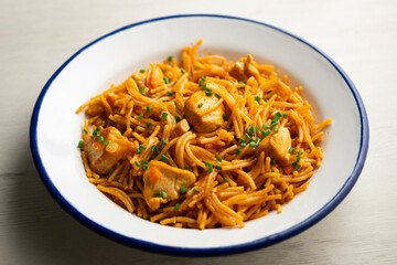 Spanish fideua paella with chicken and vegetables.