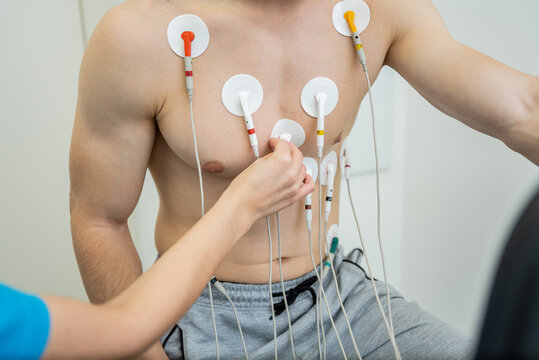 Medical professional conducting a cardiovascular evaluation with ecg electrodes