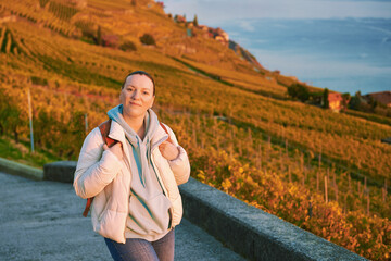 Outdoor portrait of middle age woman enjoing nice autumn day in vineyards, healthy and active...