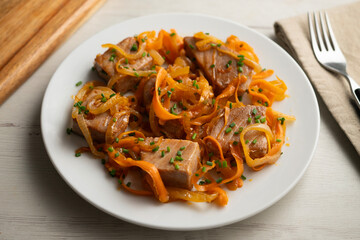 Atun encebollado. Traditional spanish tapa with premium tuna cooked with onions. © Leckerstudio