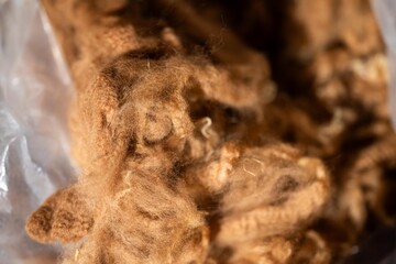 Alpaca wool in a bag after shearing on a farm in australia