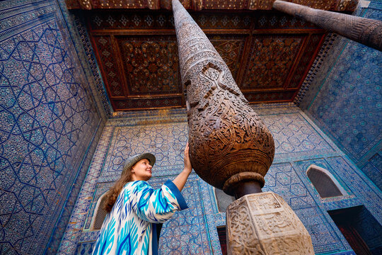 Woman tourist at old city Khiva in Uzbekistan