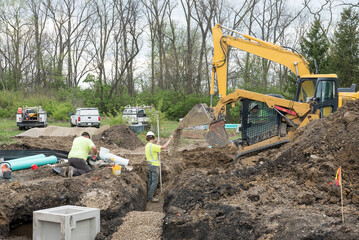 Excavation Crew Creating Drainage System Infrastructure