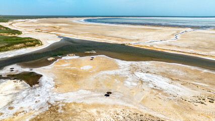 the salt river flows into the salt lake Baskunchak and creates a fantastic landscape view from a...