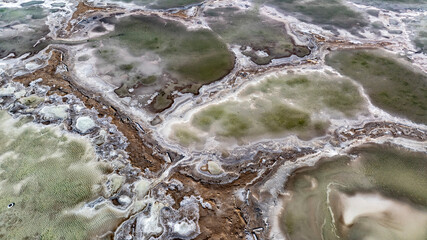 cosmic unreal landscapes of the Baskunchak salt lake on a spring day from the height of a drone...