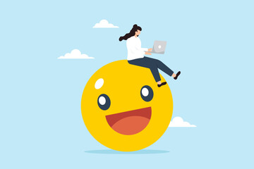 Businesswoman works on her laptop while sitting on smiling face emoji. Concept of finding joy and satisfaction in work, passion, enjoyment, positive relationship with company, and employee wellbeing