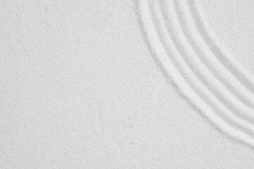 Zen garden, Japanese garden with art line pattern on white sand background,Top Sand Nature texture surface with wave lines pattern,Background banner for Harmony,Meditation,Feng Shui,Zen like concept