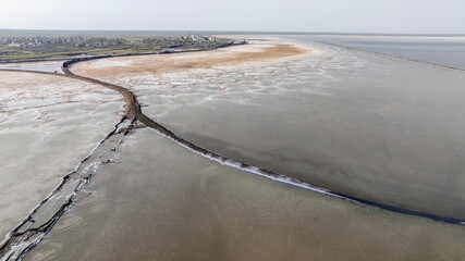 cosmic unreal landscapes of the Baskunchak salt lake on a spring day from the height of a drone...