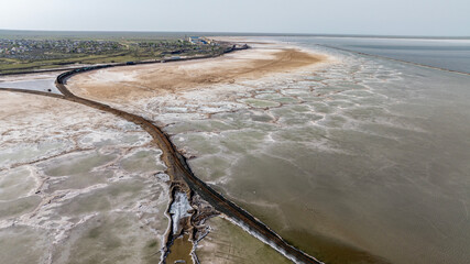 cosmic unreal landscapes of the Baskunchak salt lake on a spring day from the height of a drone...