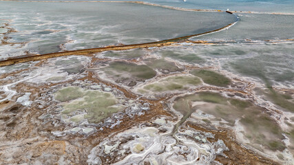 cosmic unreal landscapes of the Baskunchak salt lake on a spring day from the height of a drone flight